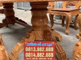 Bàn ăn bầu dục gỗ gõ đỏ 8 ghế hoa lá tây Chị Lam (Sơn La) 9 Chân Bàn ăn gỗ Gõ