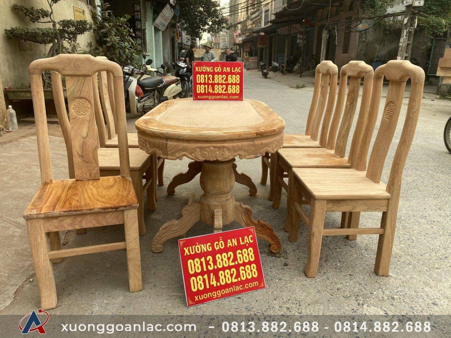 Bộ bàn ghế ăn chữ thọ gỗ gõ kate 6 ghế bàn bầu dục 13 Yếm bàn dày 3 phân được trang trí hoa lá tây cân đối với đường nét đục sâu, uyển chuyển.