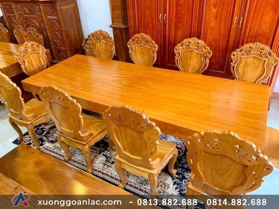 Bộ bàn ăn nguyên khối gỗ gõ đỏ 10 ghế đục hoa lá tây (Chú Giang, Ninh Bình) 19 Bàn ăn nguyên tấm làm bằng gỗ gõ đỏ vân siêu đẹp, độ bền vĩnh cửu.