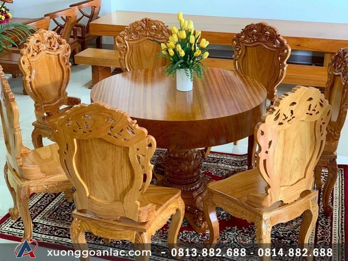 Bộ bàn ăn tròn nguyên khối gỗ gõ đỏ 7 ghế đục hoa lá tây (Anh Sơn, Hà Nội) 13 bàn tròn chân trụ lục bình