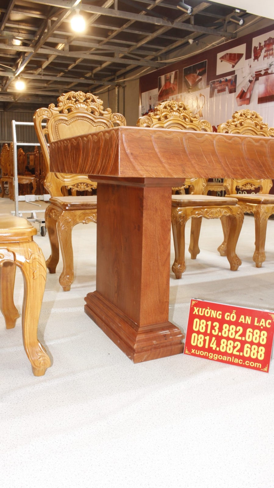Bộ bàn ăn nguyên khối 10 ghế hoa lá tây gỗ hương đá cao cấp 41 bàn nguyên khối chân bản lớn