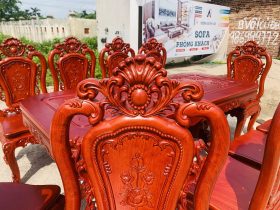 Bộ bàn ăn chữ nhật bo góc 10 ghế hồng hạt gỗ hương đá (Chú Thế, Cần Thơ) 25 đỉnh chương đục vòm hoa lá tây