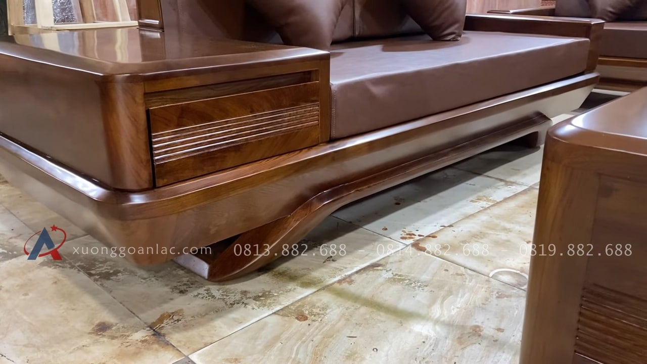 Bộ sofa chân chếch vát hàng đặt gỗ hương PU màu óc chó kèm bộ da đệm Hàn Quốc (Anh Thịnh - Hà Nam) 42 bệ tay có tích hợp ngăn kéo.
